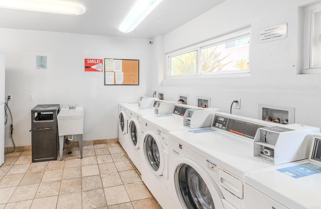 9860 Dale Avenue, Unit D10 Spring Valley, CA 91977 - Photo 39 of 55 a utility room with cabinets dryer and washer