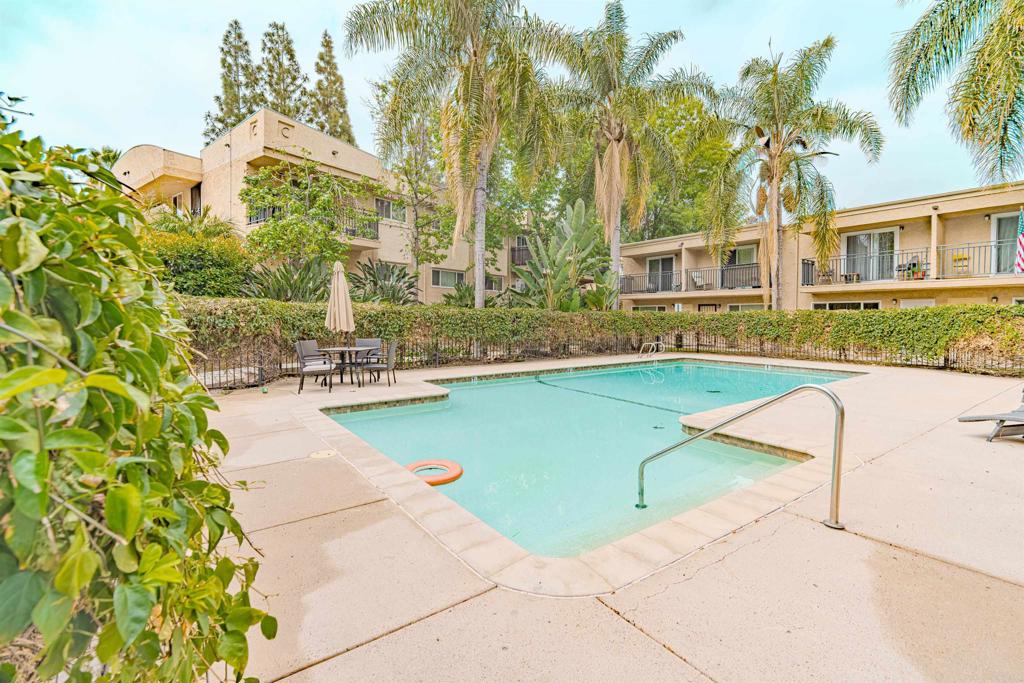 9860 Dale Avenue, Unit D10 Spring Valley, CA 91977 - Photo 40 of 55 a swimming pool with outdoor seating and yard