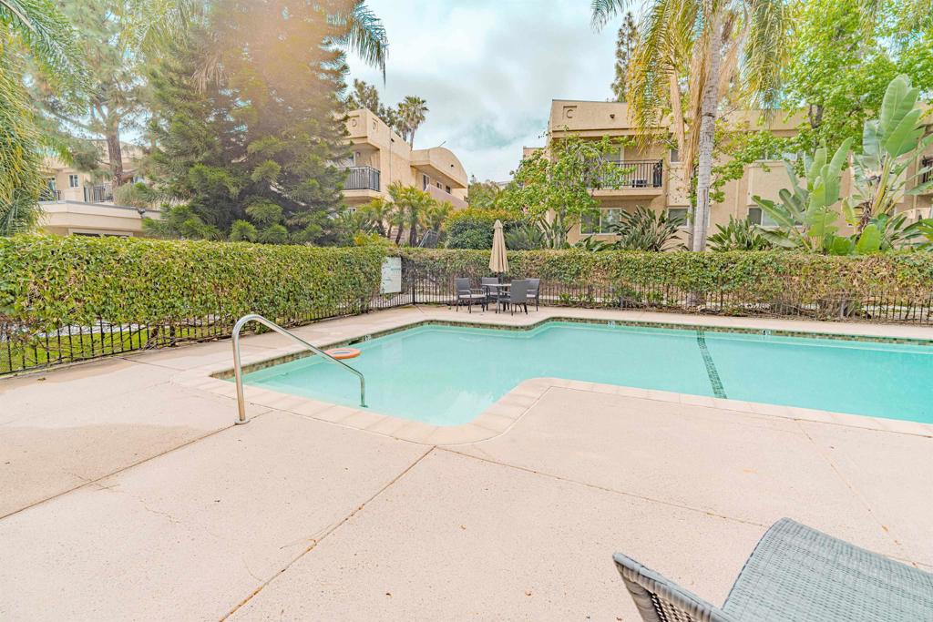 9860 Dale Avenue, Unit D10 Spring Valley, CA 91977 - Photo 41 of 55 a swimming pool with lawn chairs and a yard