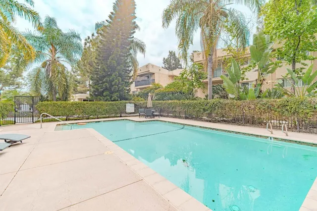 a view of a swimming pool with a patio