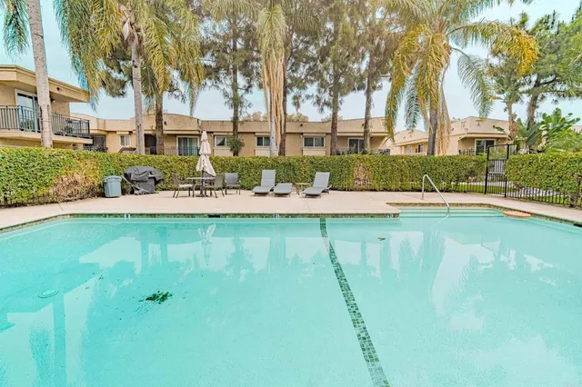 a house with swimming pool in front of it