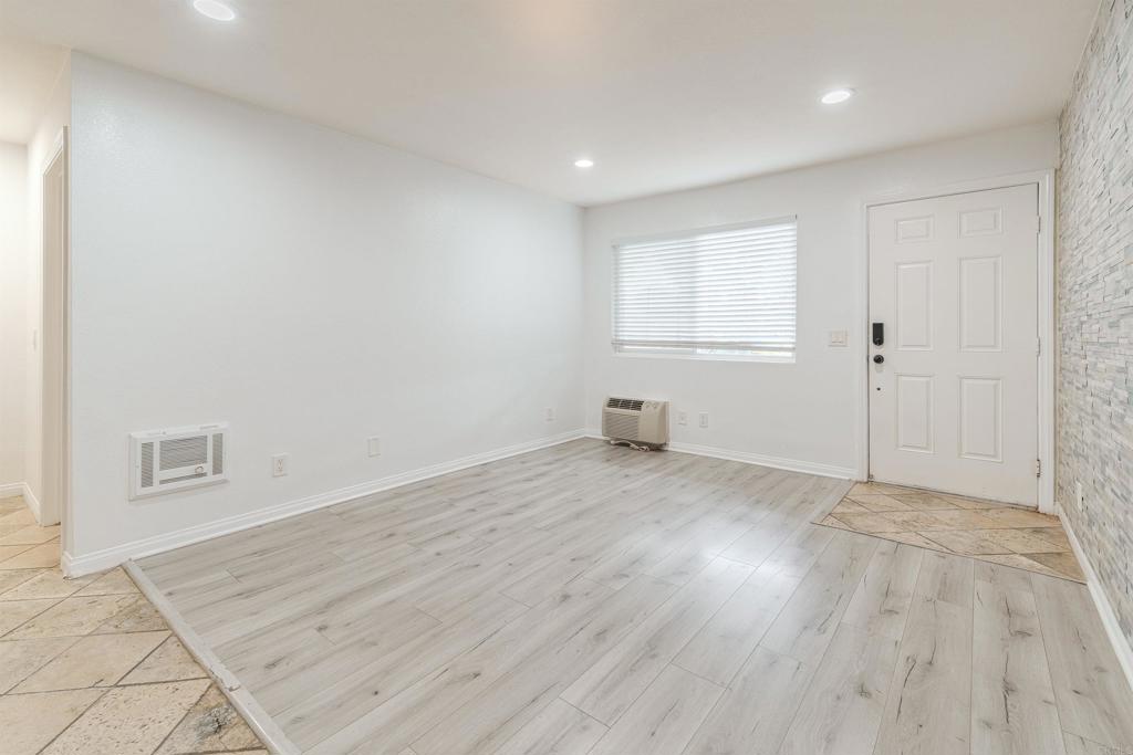 9860 Dale Avenue, Unit D10 Spring Valley, CA 91977 - Photo 7 of 55 an empty room with wooden floor and windows