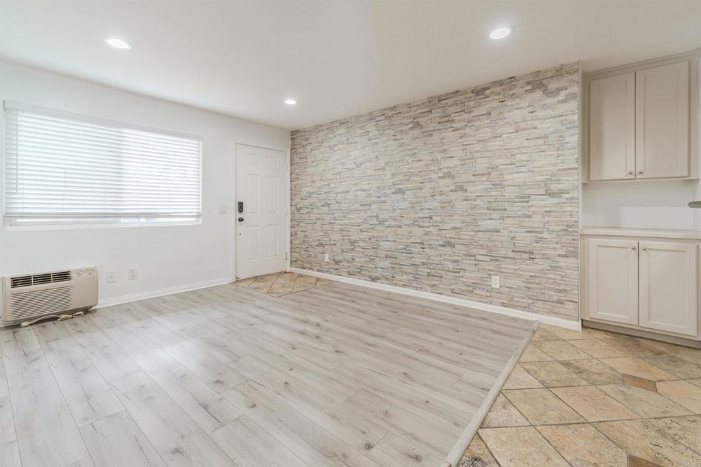 9860 Dale Avenue, Unit D10 Spring Valley, CA 91977 - Photo 8 of 55 an empty room with wooden floor and windows