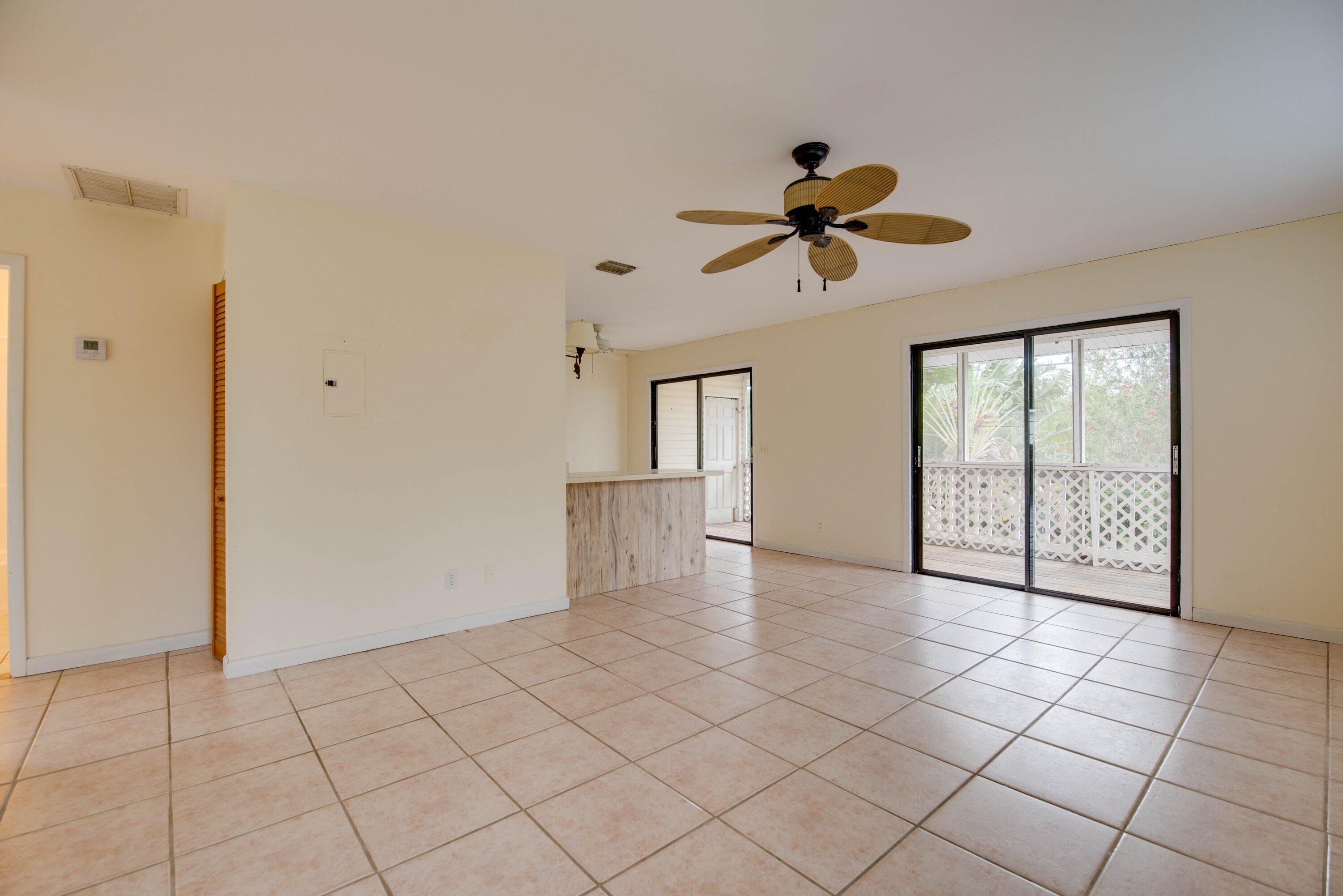 28451 Gulf Boulevard Big Pine Key, FL 33043 - Photo 8 of 28 018-28451GulfBlvd Living Room with slide