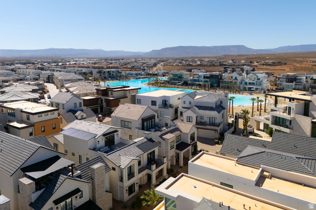 5354 Cyan Lane St. George, UT 84790 - Photo 36 of 45 Aerial perspective of suburban area with mountains and a pool area