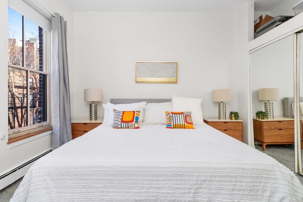 28 Worcester Square, Unit 3 Boston, MA 02118 - Photo 11 of 15 a bed room with a bed and a large window