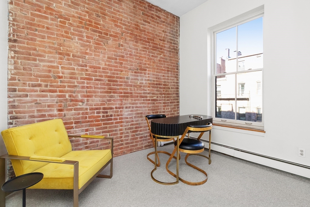 28 Worcester Square, Unit 3 Boston, MA 02118 - Photo 12 of 15 a view of a livingroom with furniture and a window