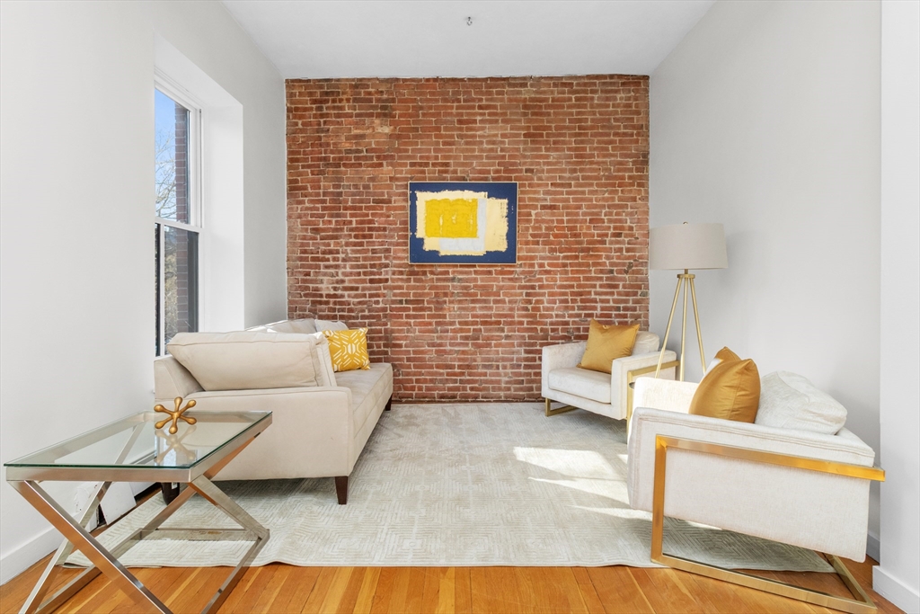 28 Worcester Square, Unit 3 Boston, MA 02118 - Photo 2 of 15 a living room with furniture and a table