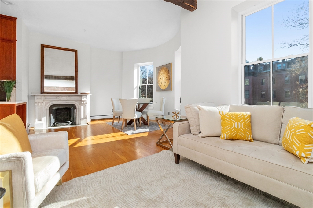 28 Worcester Square, Unit 3 Boston, MA 02118 - Photo 3 of 15 a living room with furniture and a fireplace