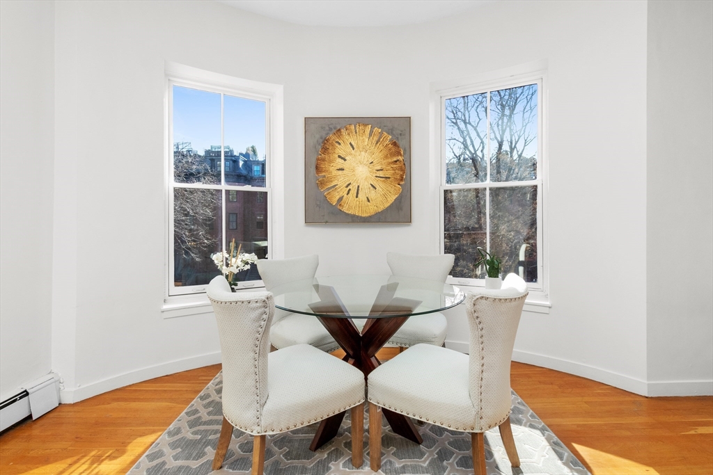 28 Worcester Square, Unit 3 Boston, MA 02118 - Photo 5 of 15 a view of a dining room with furniture and wooden floor