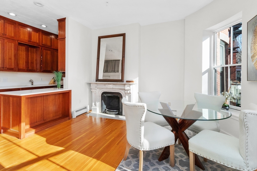 28 Worcester Square, Unit 3 Boston, MA 02118 - Photo 8 of 15 a living room with fireplace furniture and a window