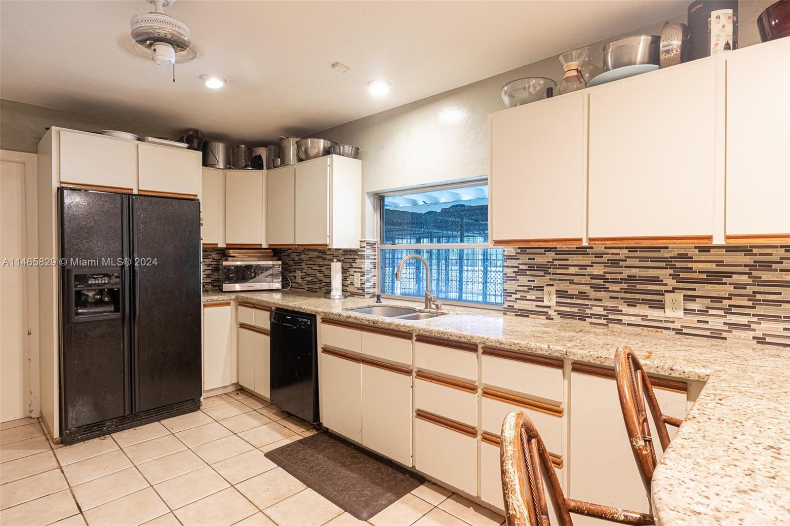 6000 Southwest 118th Avenue Miami, FL 33183 - Photo 12 of 49 a kitchen with stainless steel appliances granite countertop a refrigerator and a sink
