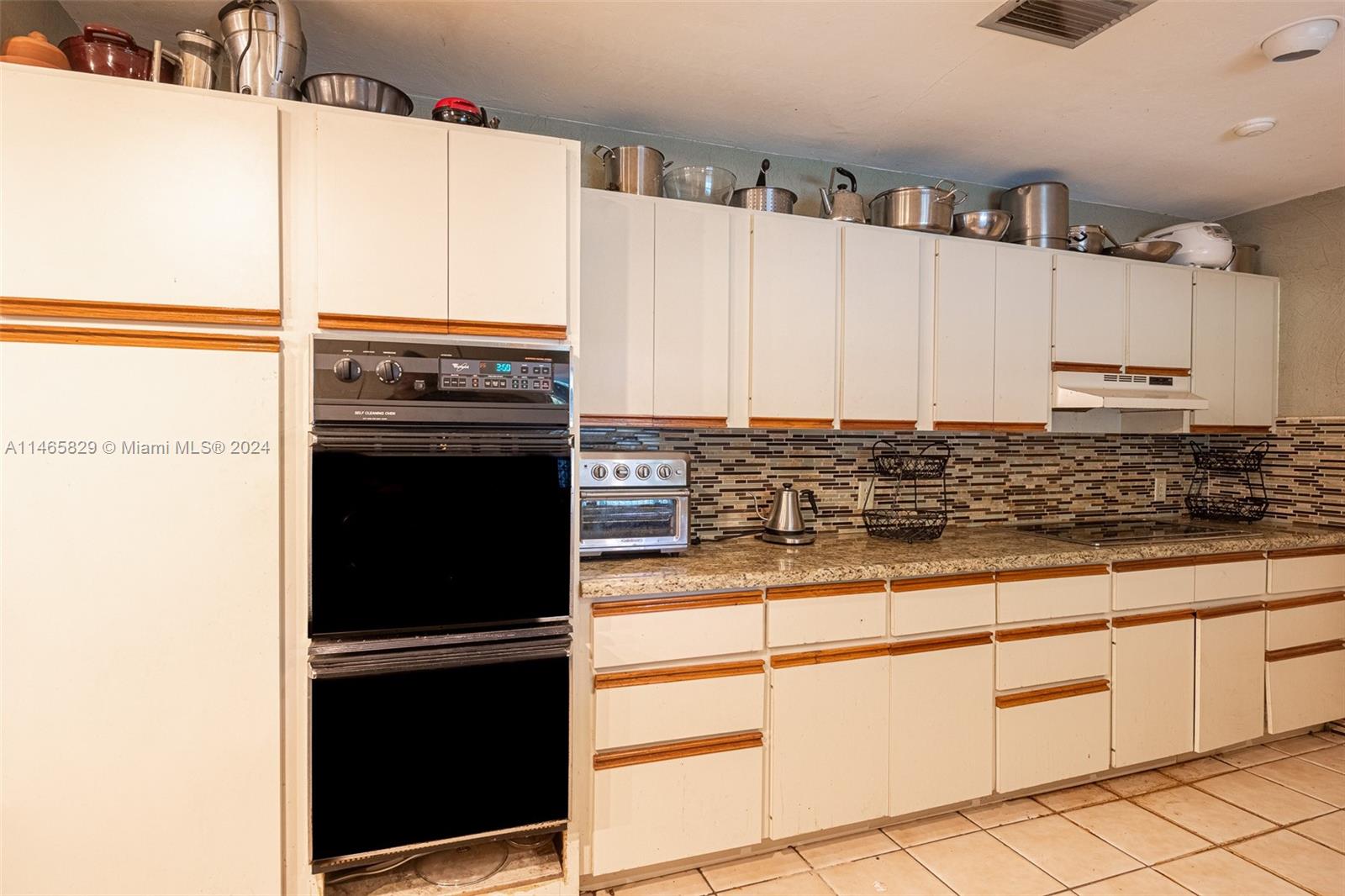 6000 Southwest 118th Avenue Miami, FL 33183 - Photo 13 of 49 a view of a kitchen with appliances and cabinets