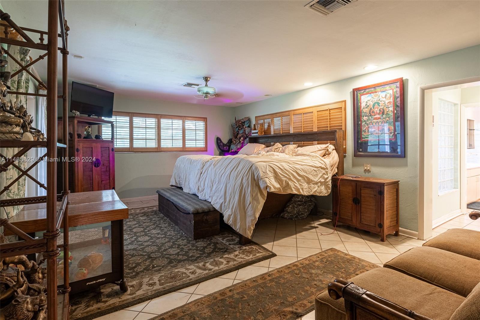6000 Southwest 118th Avenue Miami, FL 33183 - Photo 17 of 49 a bed room with a bed and a couch