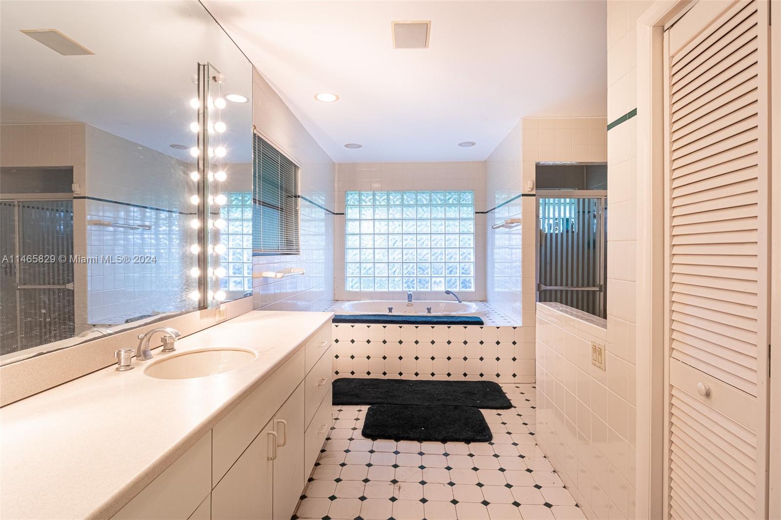 6000 Southwest 118th Avenue Miami, FL 33183 - Photo 18 of 49 a bathroom with a bathtub sink and a shower