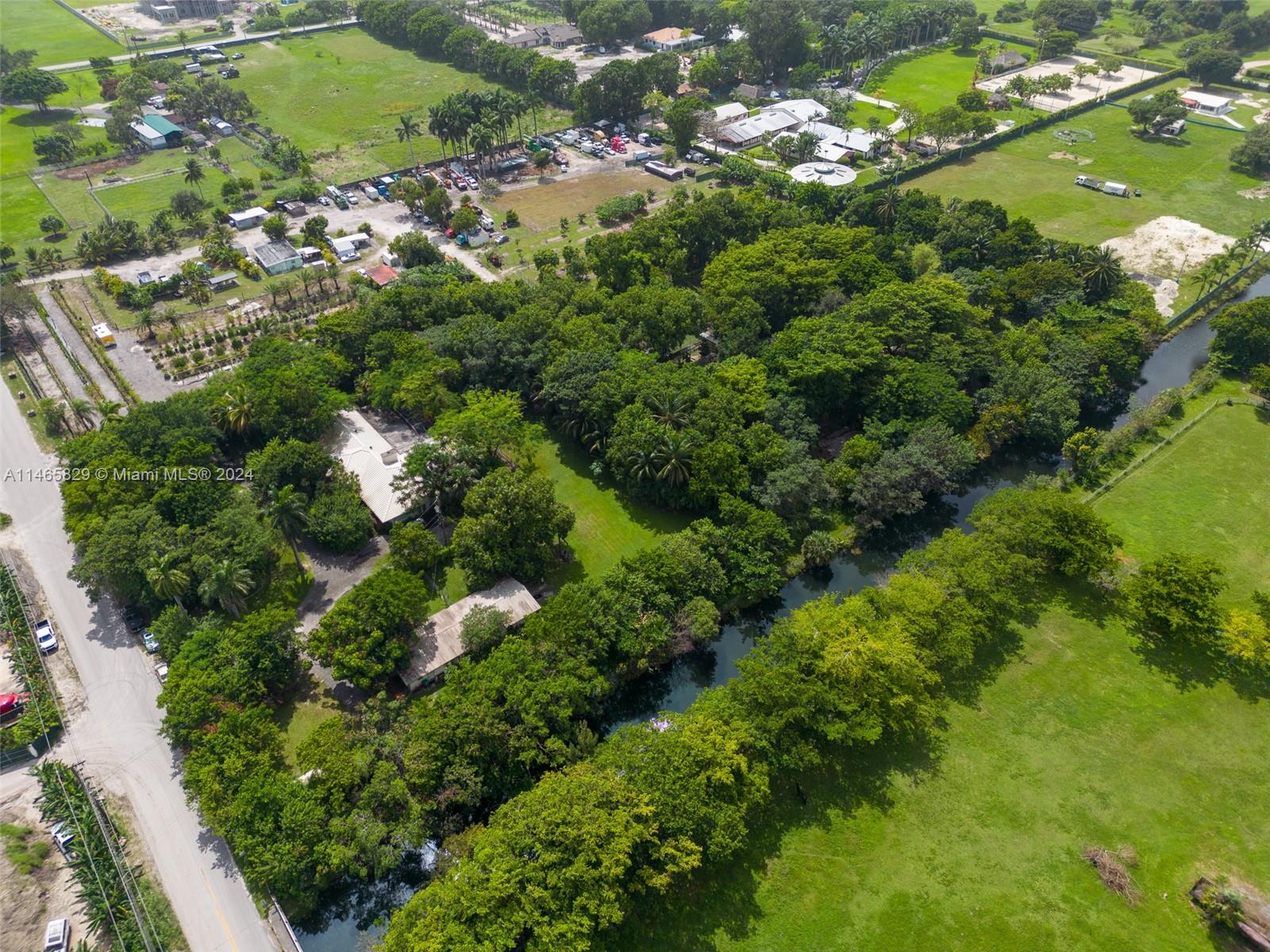 6000 Southwest 118th Avenue Miami, FL 33183 - Photo 2 of 49 an aerial view of residential houses with outdoor space and trees