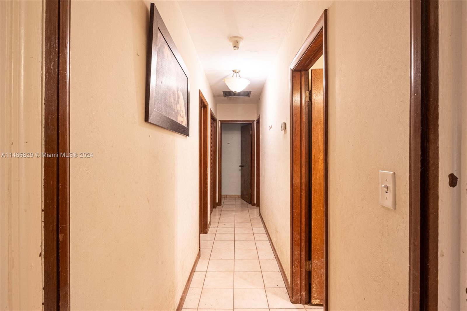 6000 Southwest 118th Avenue Miami, FL 33183 - Photo 22 of 49 a view of a hallway with wooden floor and a bathroom