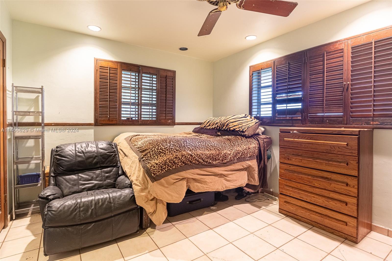 6000 Southwest 118th Avenue Miami, FL 33183 - Photo 24 of 49 a bedroom with a bed and window