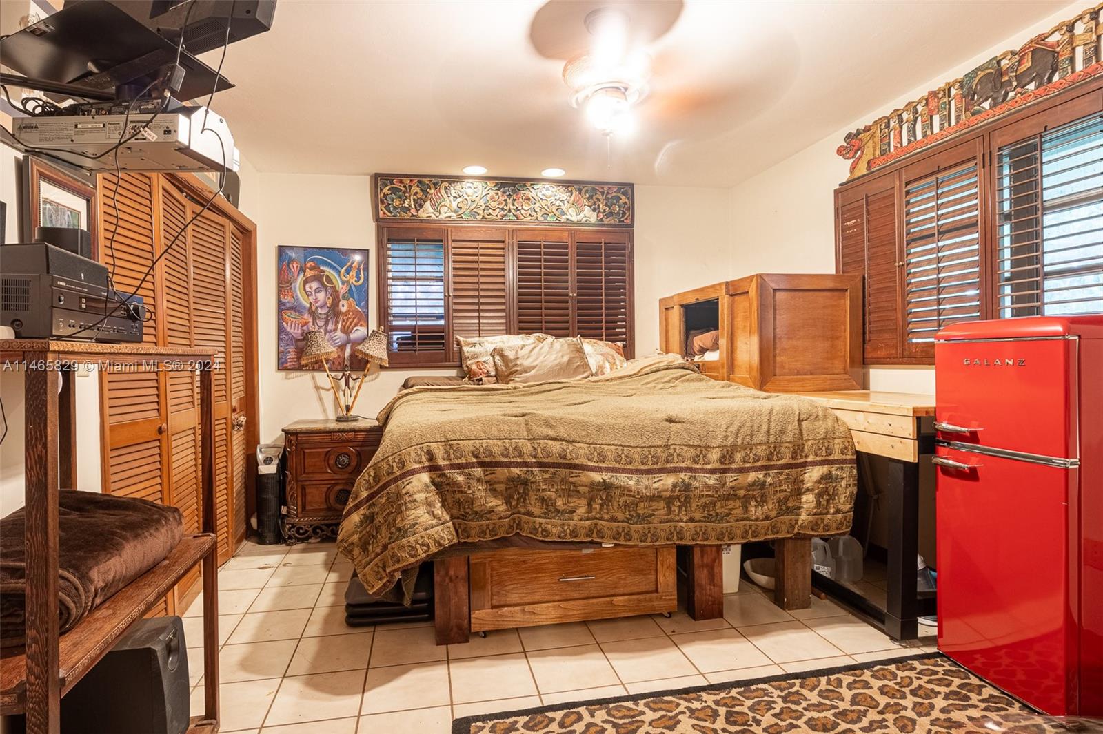 6000 Southwest 118th Avenue Miami, FL 33183 - Photo 26 of 49 a spacious bedroom with a bed and a table