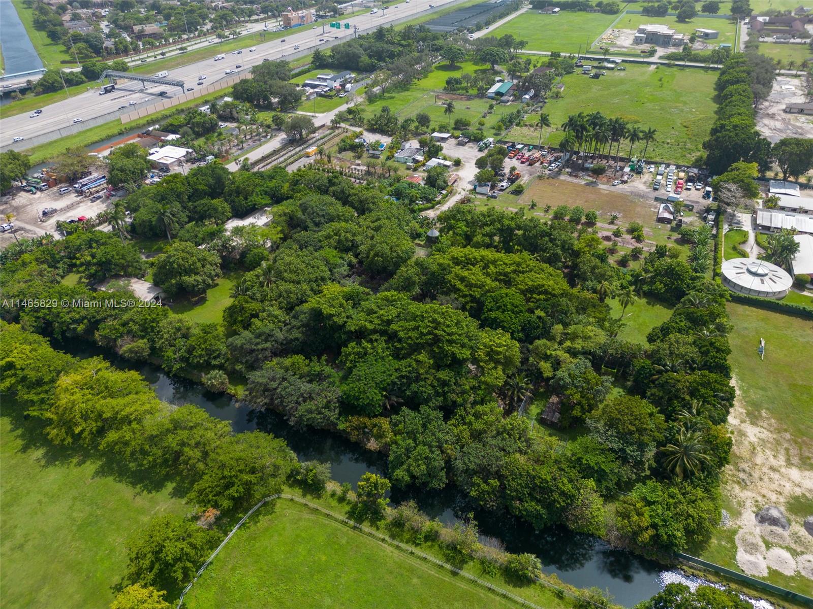 6000 Southwest 118th Avenue Miami, FL 33183 - Photo 3 of 49 an aerial view of residential houses with outdoor space and trees