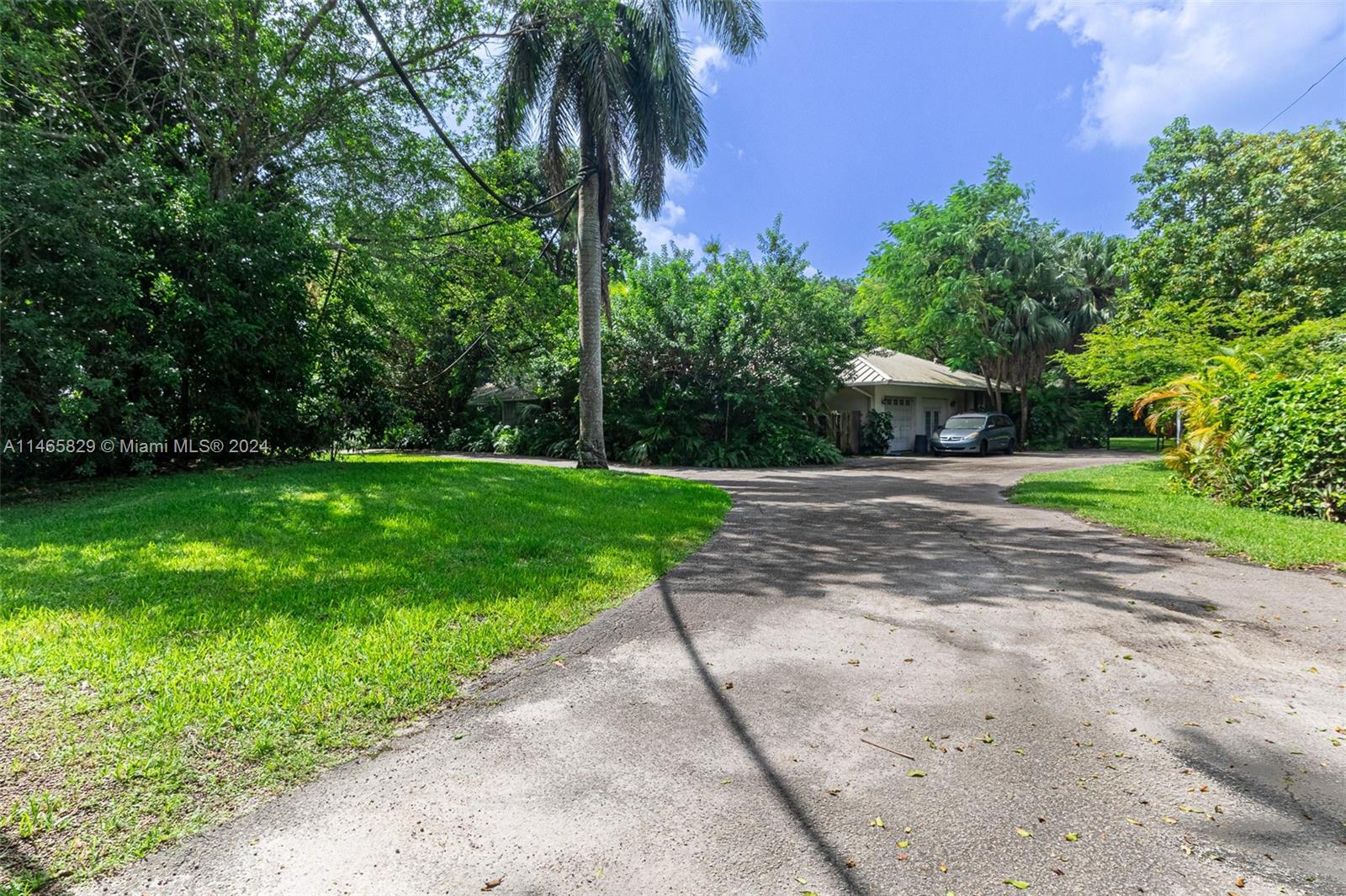 6000 Southwest 118th Avenue Miami, FL 33183 - Photo 31 of 49 a front view of a house with a yard and trees