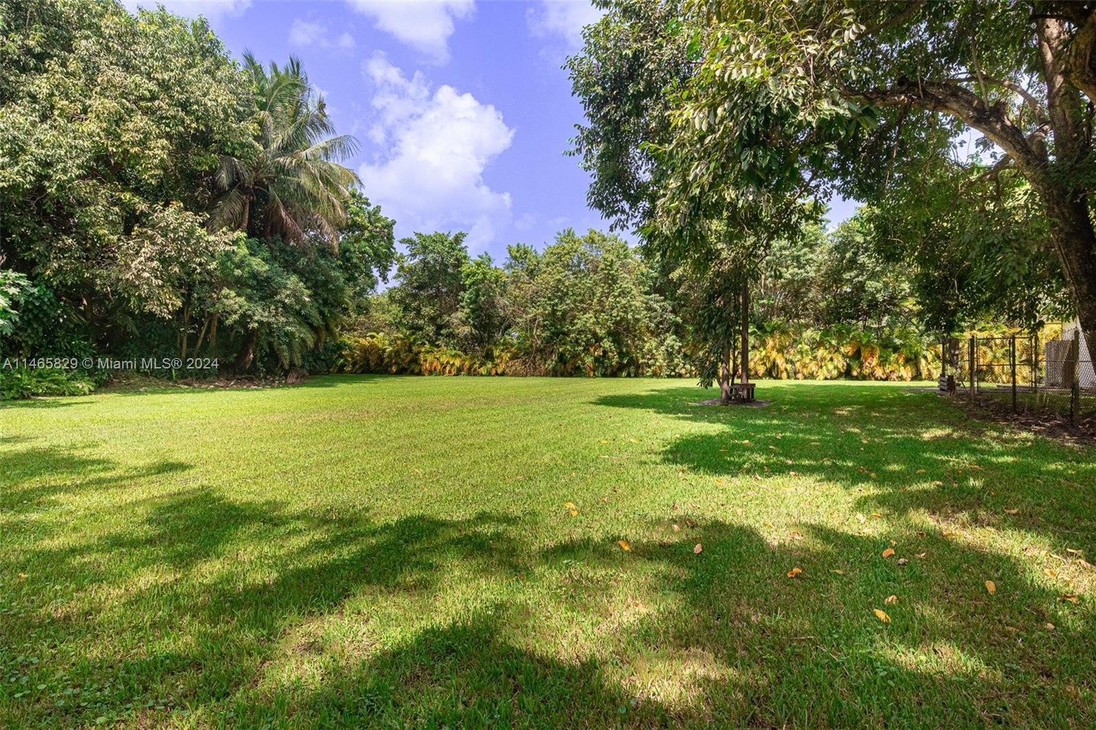 6000 Southwest 118th Avenue Miami, FL 33183 - Photo 37 of 49 a view of a grassy field with trees