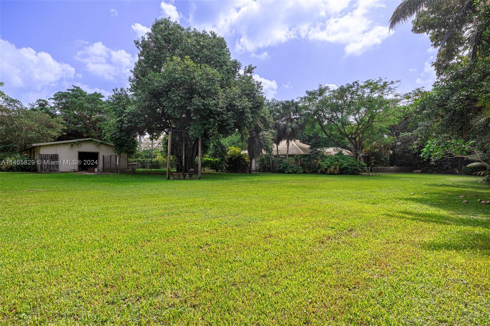 6000 Southwest 118th Avenue Miami, FL 33183 - Photo 39 of 49 a view of a yard with a house in the background