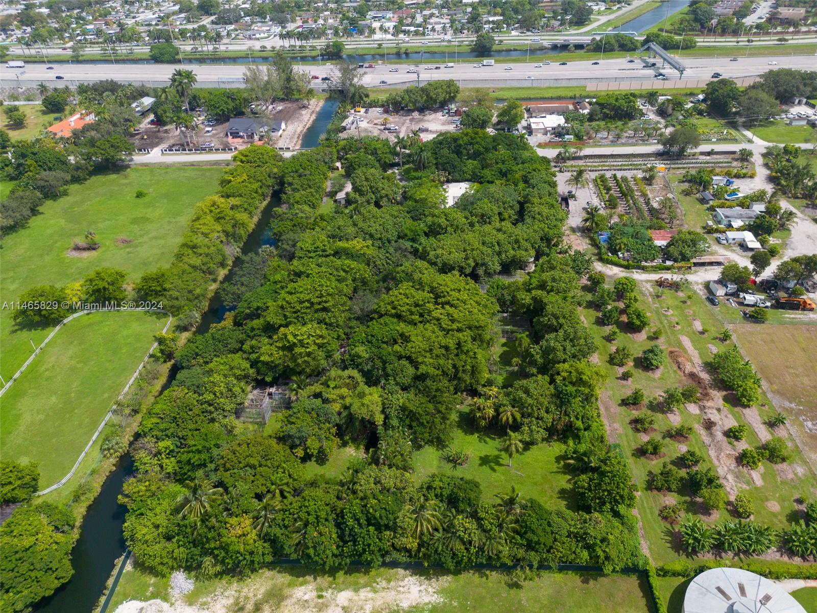6000 Southwest 118th Avenue Miami, FL 33183 - Photo 4 of 49 a view of a lake with a city