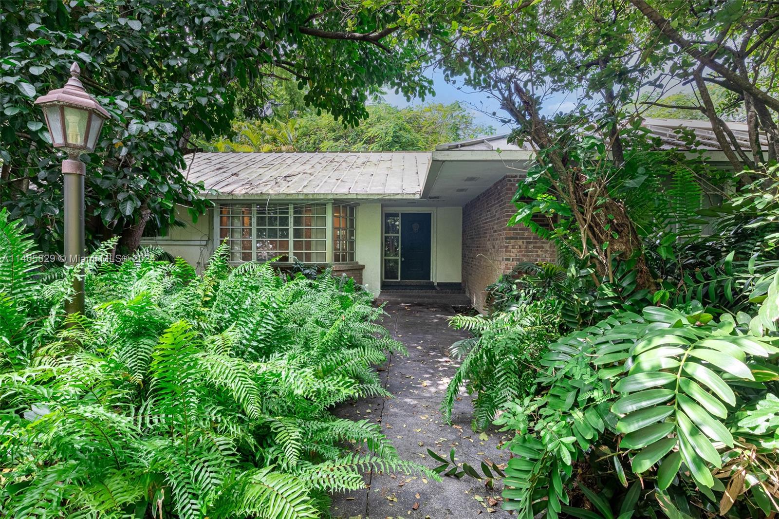 6000 Southwest 118th Avenue Miami, FL 33183 - Photo 7 of 49 a view of a house with a tree