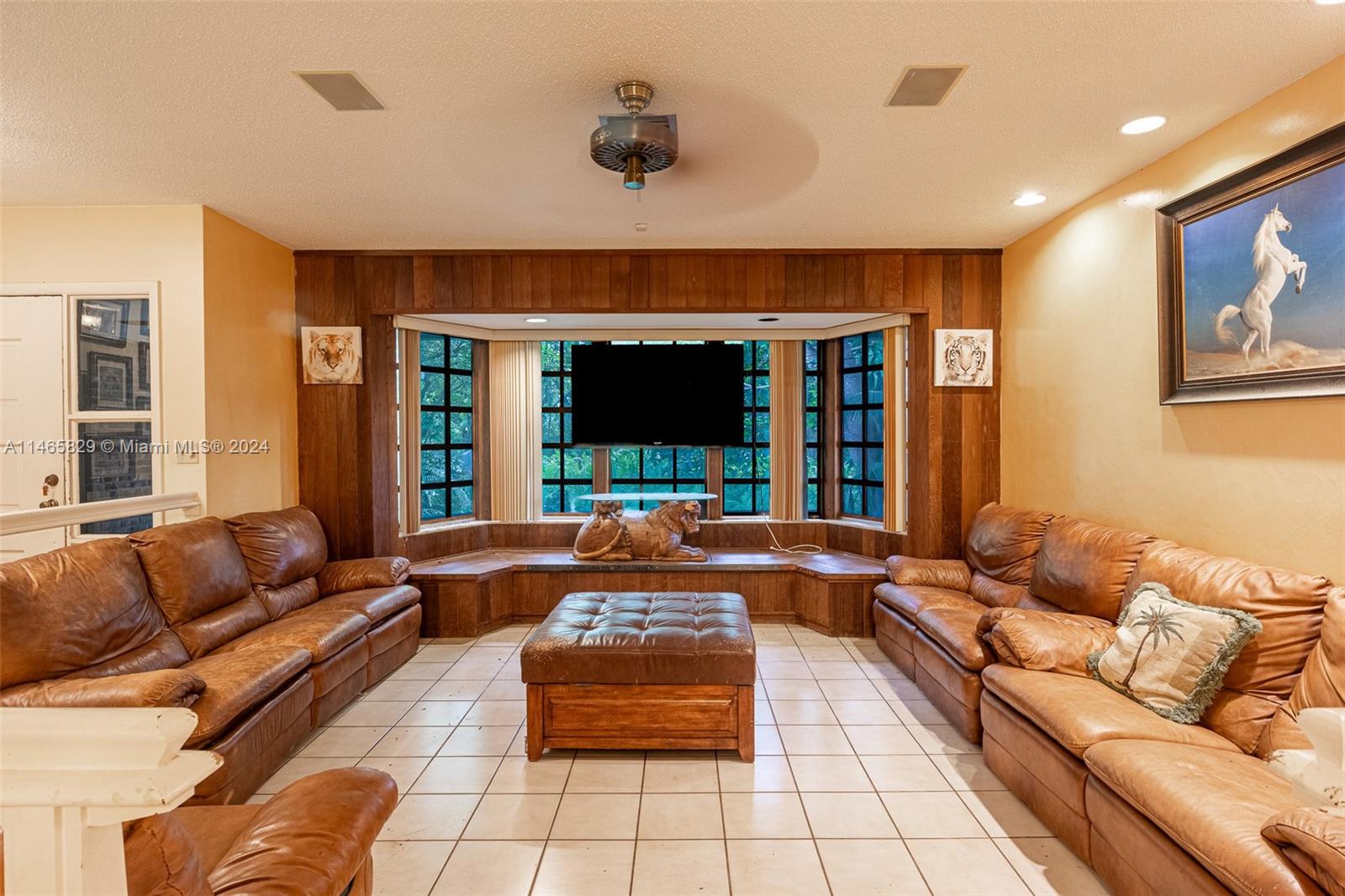 6000 Southwest 118th Avenue Miami, FL 33183 - Photo 8 of 49 a living room with furniture and a flat screen tv