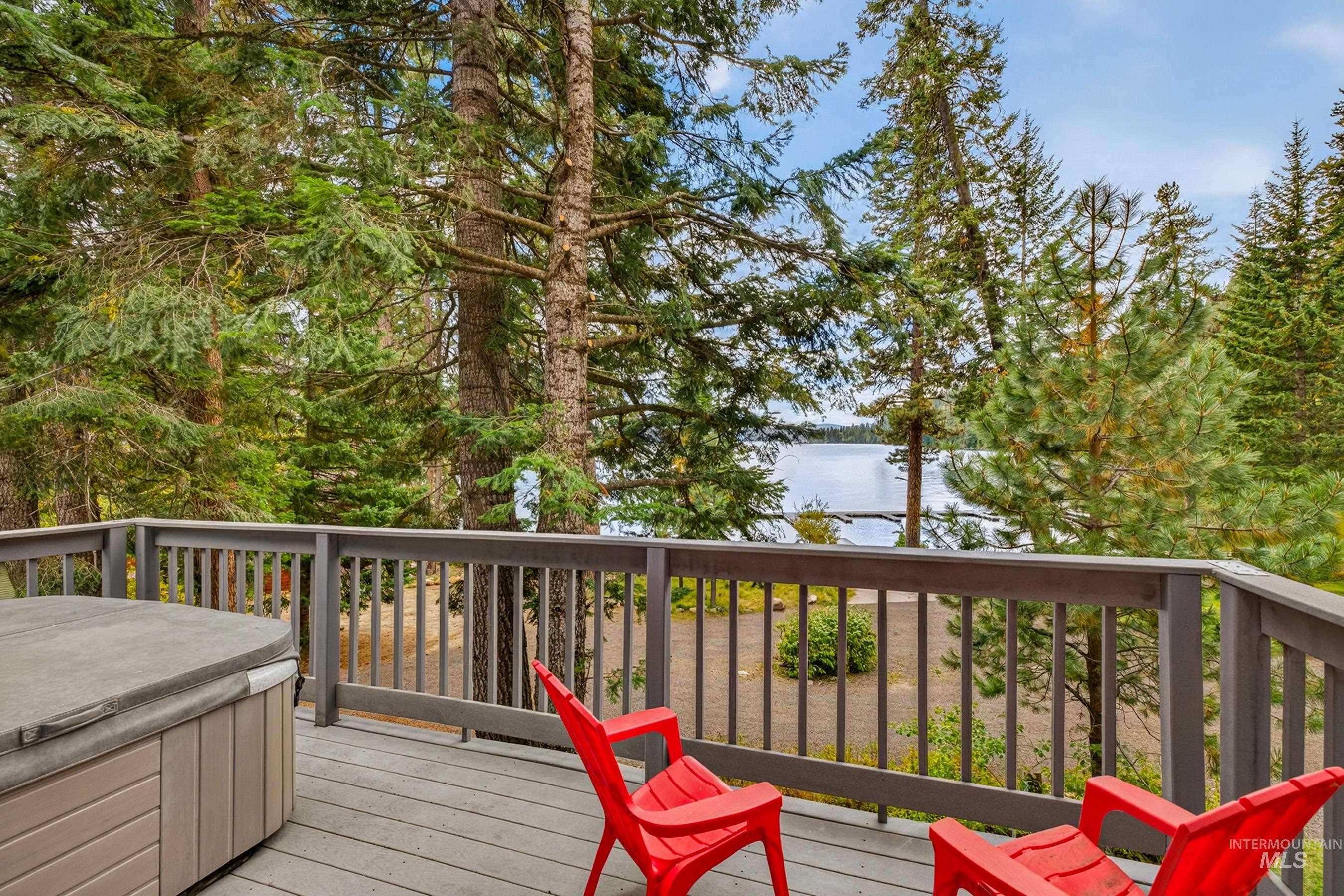 3531 Kp Cove Road McCall, ID 83638 - Photo 3 of 49 Expansive deck with wood-finish flooring, lattice railing, and built-in bench seating