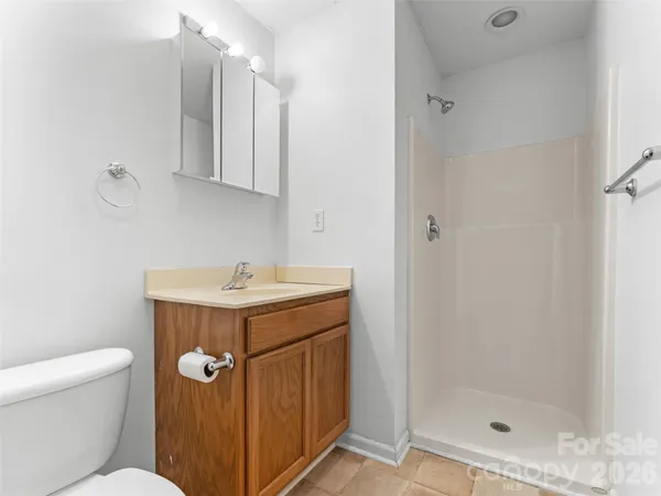a utility room with cabinets washer and dryer