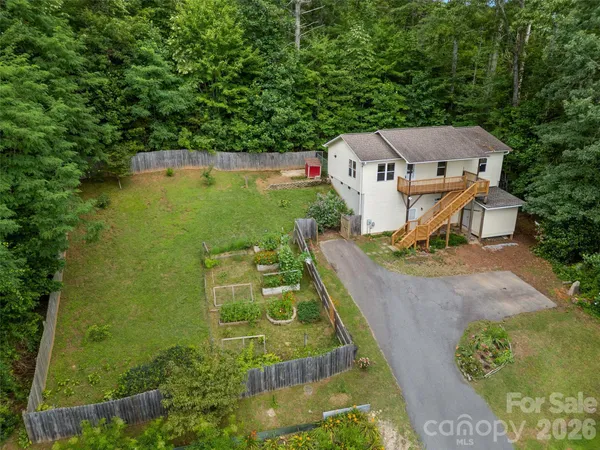 an aerial view of a house with a garden
