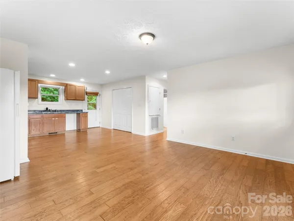 a view of a kitchen with a sink and a microwave