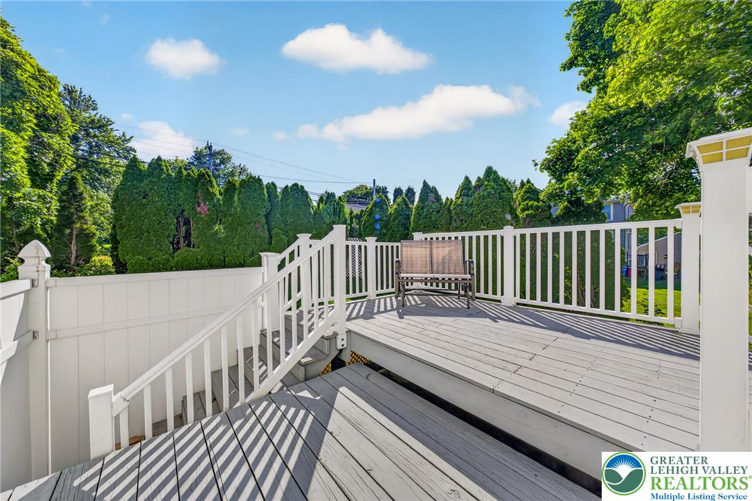 1702 Red Bud Road Quakertown, PA 18951 - Photo 65 of 68 A spacious wooden deck provides ample outdoor entertaining space, enveloped by verdant privacy plantings.