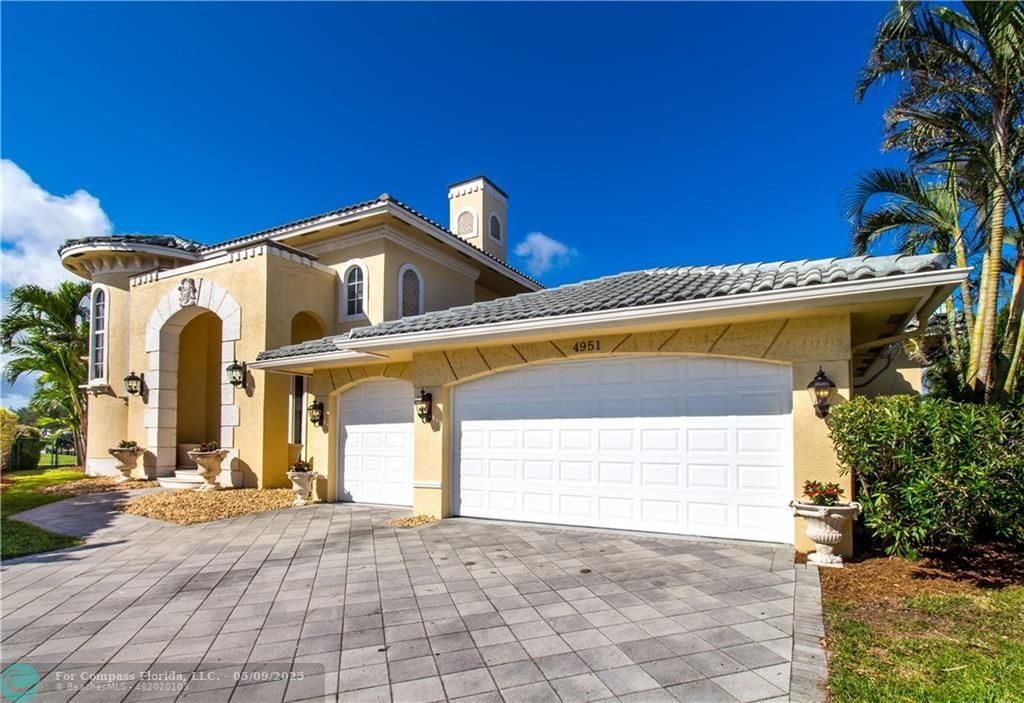 a front view of a house with a garage