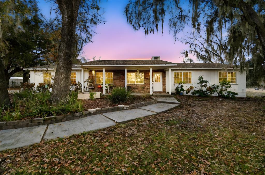 3009 Jim Johnson Road Plant City, FL 33566 - Photo 1 of 84 front view of a house with a small yard