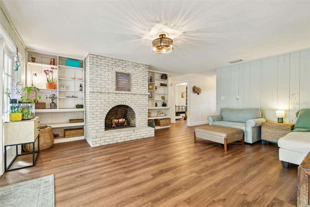 3009 Jim Johnson Road Plant City, FL 33566 - Photo 11 of 84 a living room with furniture and a fireplace