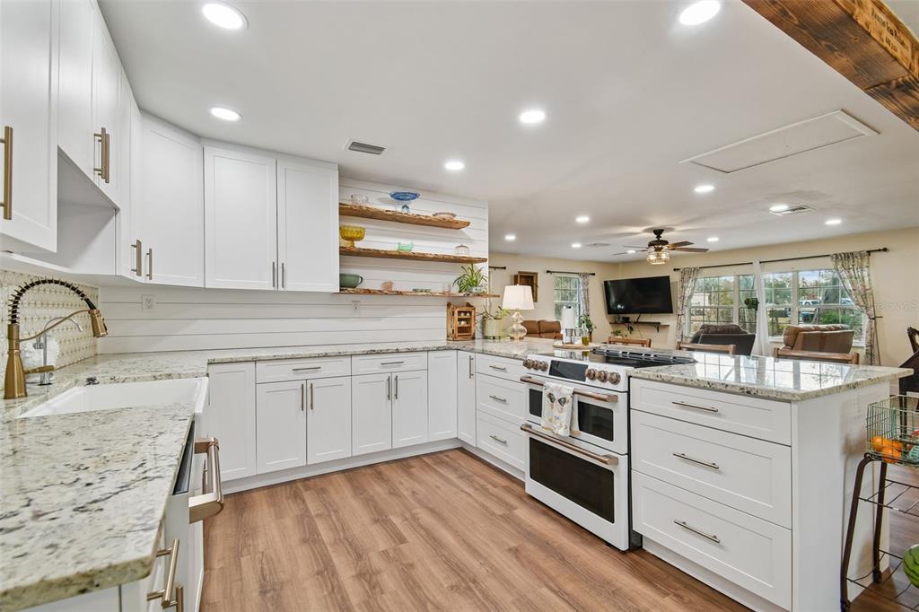 3009 Jim Johnson Road Plant City, FL 33566 - Photo 13 of 84 a kitchen with appliances a sink and cabinets