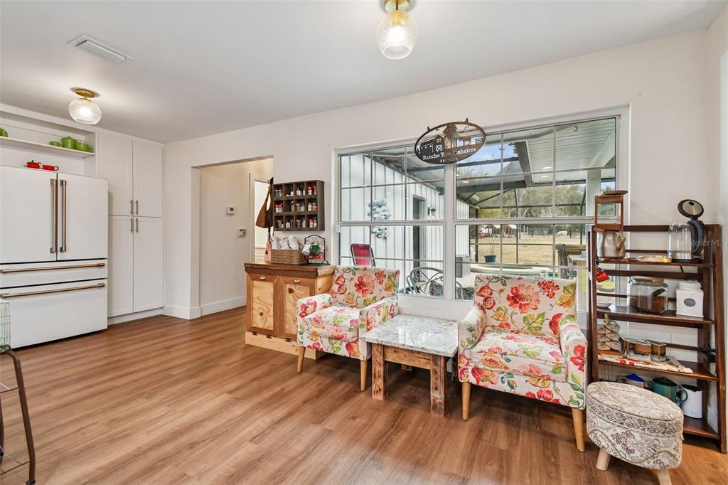 3009 Jim Johnson Road Plant City, FL 33566 - Photo 23 of 84 a living room with furniture and wooden floor