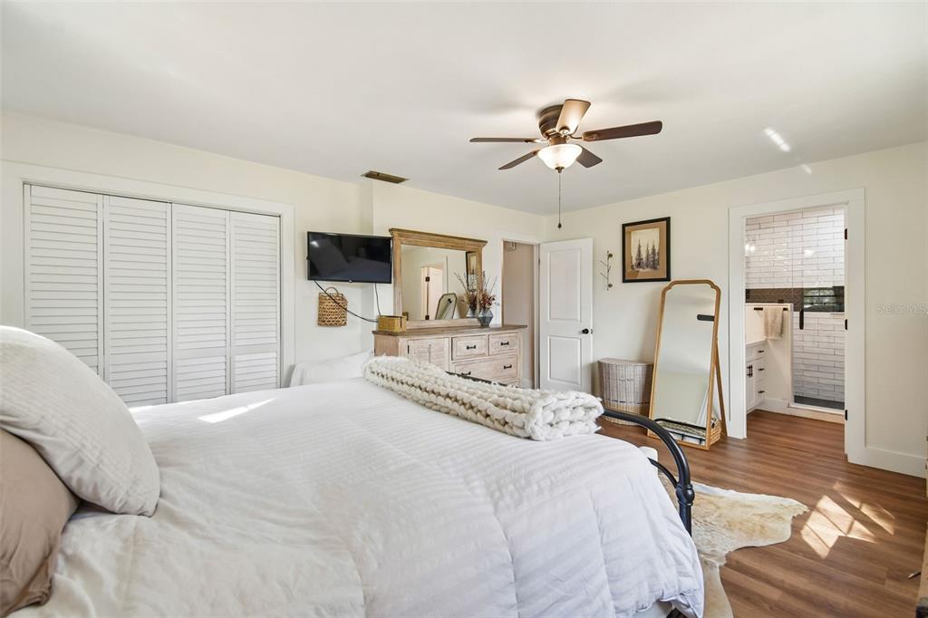 3009 Jim Johnson Road Plant City, FL 33566 - Photo 32 of 84 a bedroom with a bed ceiling fan and a window