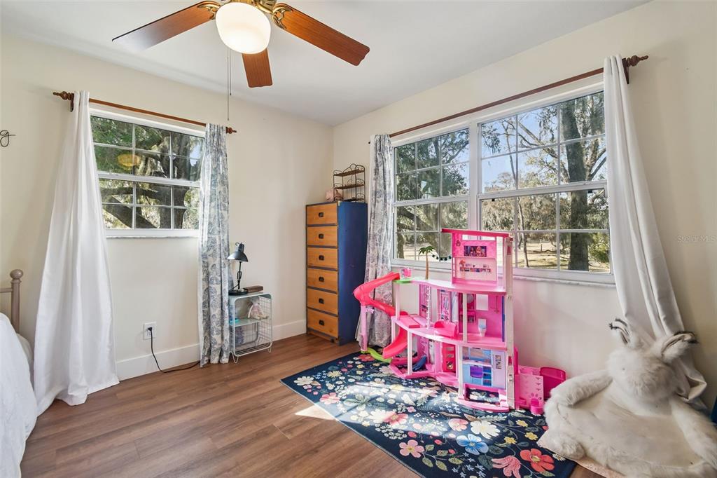 3009 Jim Johnson Road Plant City, FL 33566 - Photo 36 of 84 a bedroom with furniture and a window