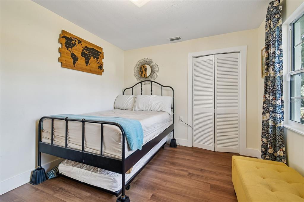 3009 Jim Johnson Road Plant City, FL 33566 - Photo 41 of 84 a bedroom with a bed and a painting on the wall