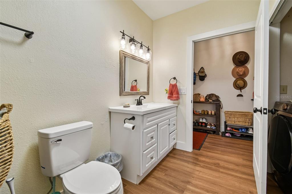 3009 Jim Johnson Road Plant City, FL 33566 - Photo 45 of 84 a bathroom with a double vanity sink toilet and shower