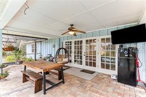 3009 Jim Johnson Road Plant City, FL 33566 - Photo 49 of 84 a living room with furniture a flat screen tv and a large window