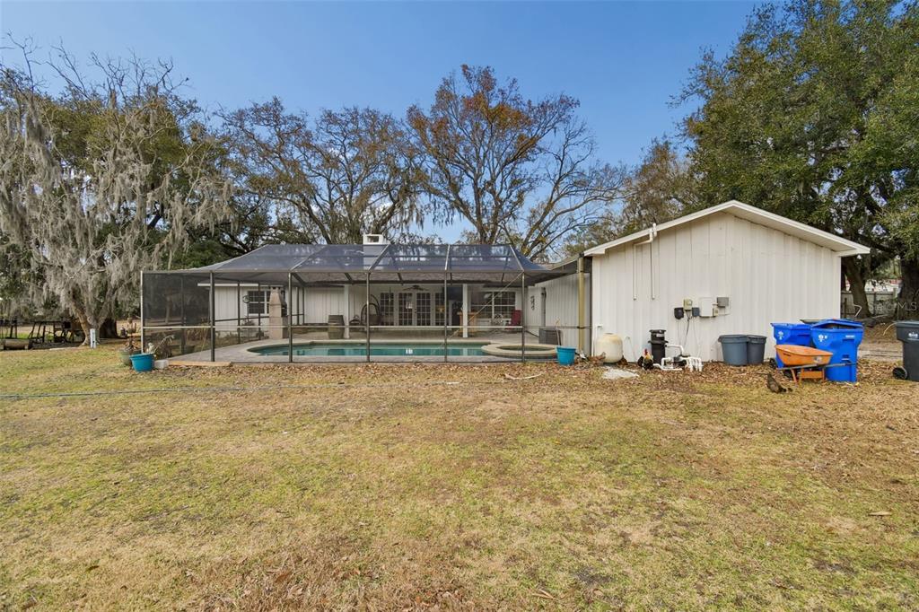 3009 Jim Johnson Road Plant City, FL 33566 - Photo 52 of 84 a view of a house with backyard and trees