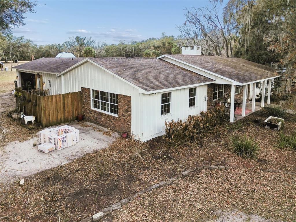3009 Jim Johnson Road Plant City, FL 33566 - Photo 70 of 84 a view of a house with backyard and trees
