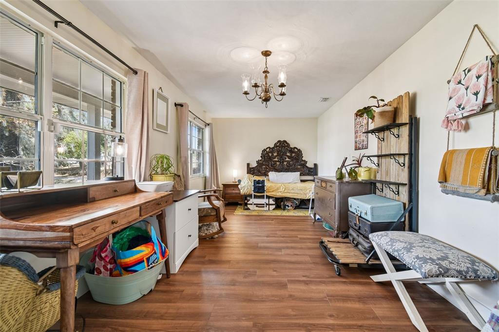3009 Jim Johnson Road Plant City, FL 33566 - Photo 8 of 84 a living room with furniture fireplace and a large window