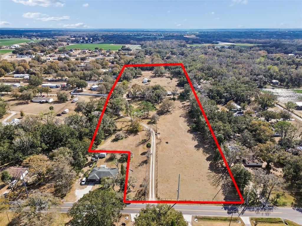 3009 Jim Johnson Road Plant City, FL 33566 - Photo 82 of 84 an aerial view of a houses with an outdoor space