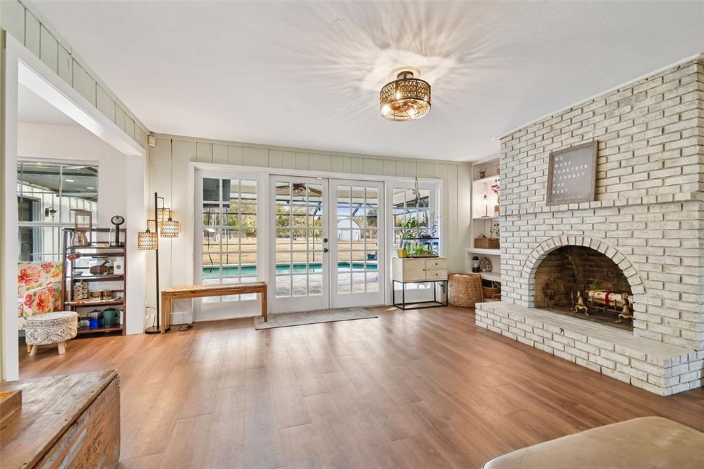 3009 Jim Johnson Road Plant City, FL 33566 - Photo 10 of 84 a living room with furniture and a fireplace